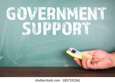 Government Support. Business Crisis, Unemployment, Downtime And Restrictions. Calculator In A Man's Hand