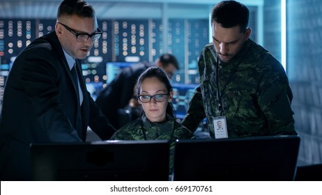 Government Surveillance Agency and Military Joint Operation. Male Agent, Female and Male Military Officers Working at System Control Center. - Shutterstock ID 669170761