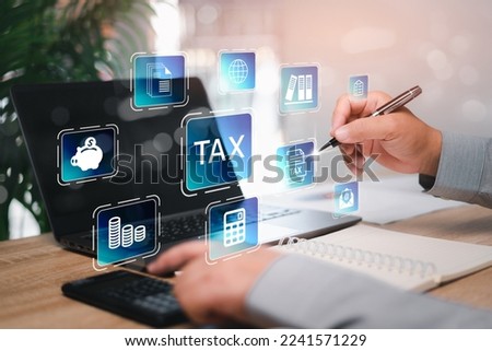 Government tax finance research and calculation tax refund concept businessman pointing to document icon on virtual screens filling online tax return form for annual tax payment over the internet