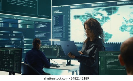 Governmental hackers execute cyber attacks by breaking passwords, compromising online security. Specialists infiltrate digital networks, breaching security protocols. Cyber surveillance. Camera B.