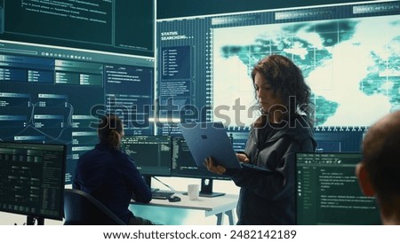 Governmental hackers execute cyber attacks by breaking passwords, compromising online security. Specialists infiltrate digital networks, breaching security protocols. Cyber surveillance. Camera B.