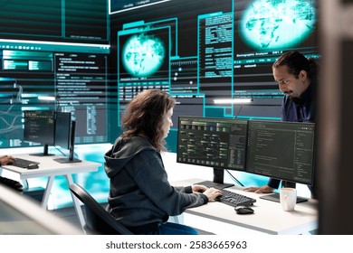 Governmental hackers using advanced software to protect against cyber threats, working in team. Specialists on cyber security, data and network protection unite forces in high tech office. - Powered by Shutterstock - Get 15% off with code: PIKWIZARD15