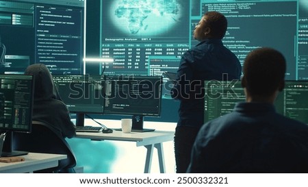 Governmental hacking group targeting sensitive information through high tech cyber attacks, digital espionage. Team of IT experts working on national security and data privacy servers. Camera A.