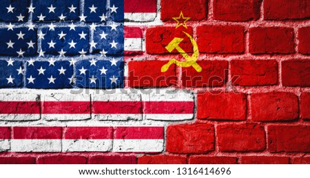 Governments conflict concept. Brick wall colored in USA and USSR flags