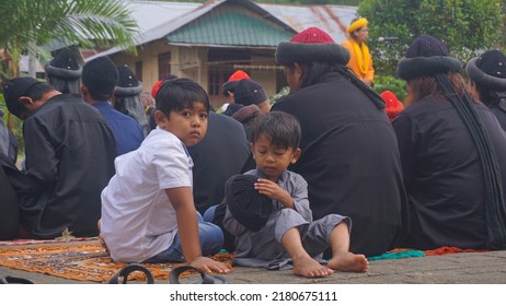 Gowa, South Sulawesi - July 21st, 2022: Two Children Were Playing While A Religious Sermon Was Taking Place.