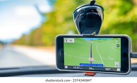 GPS car navigation along a beautiful countryside road.