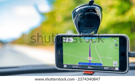 GPS car navigation along a beautiful countryside road.