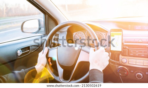 Gps device map system. Global positioning system
on smartphone screen in auto car on travel road. GPS vehicle
navigator driver device