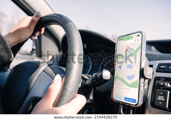 Gps device map system. Global positioning system\
on smartphone screen in auto car on travel road. GPS vehicle\
navigator driver device