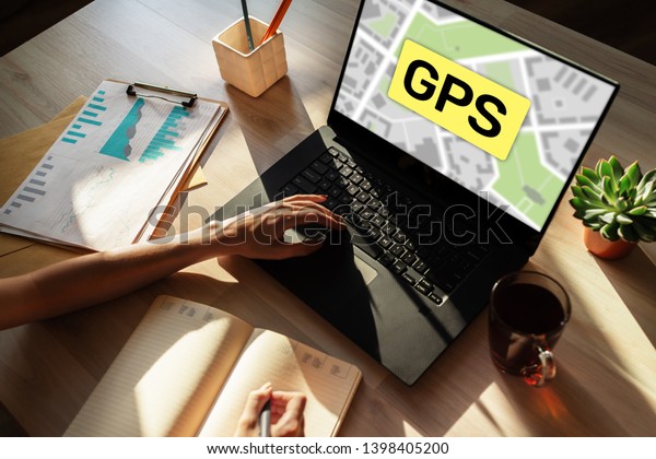 GPS Global Positioning\
System, Worldwide navigation and tracking concept with town maps on\
screen.