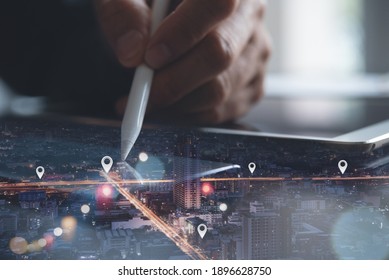 GPS map, pin address location on mobile apps, social media marketing plan, business and technology concept. Double exposure man using digital tablet searching and pinning target place on night city
