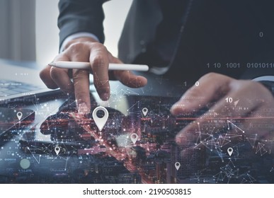 GPS map, pin address location on mobile apps. Double exposure of man hand using digital tablet searching target place on cityscape, smart logistic, global business technology concept - Shutterstock ID 2190503815