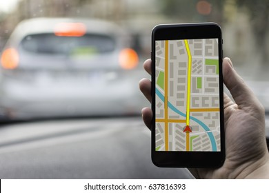 GPS Navigation on Mobile Phone Device and Transportation Concept. Male Hand Using Navigation System Map Tracking on Smartphone with Copy Space.