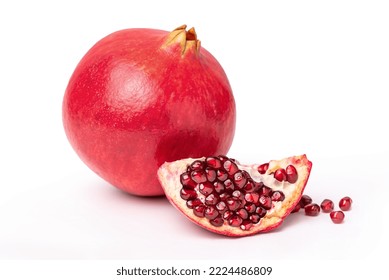 Graanate and a slice of peeled pomegranate with seeds