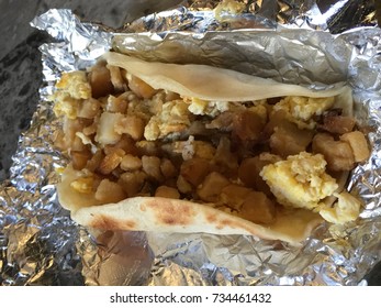 Grab A Austin , Texas Tex-mex Flour Tortilla BreakFast Taco With Scrambled Eggs And Potatoes  On Foil 