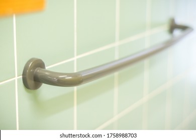 Grab Bar On A Wall Of A Pool Bathroom