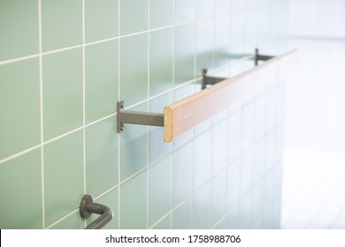 Grab Bar On A Wall Of A Pool Bathroom