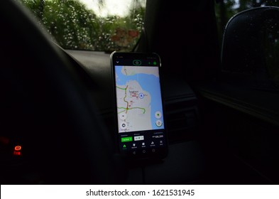 Grab Driver Application On Android Phone Attached On Car Dashboard, Photographed In Surabaya City, Indonesia, At January 14, 2020.