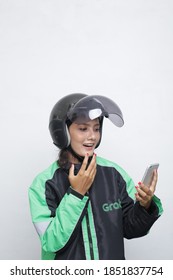 Grab Driver Asian Woman With Helmet Holding Smartphone. November 10, 2020. Jakarta Indonesia