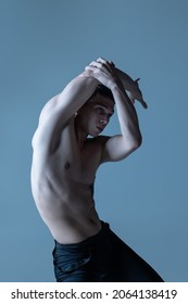 Grace And Plastic. Portrait Of Young Man, Flexible Male Ballet Dancer Dancing Isolated On Old Navy Studio Background. Art, Motion, Action, Flexibility, Inspiration Concept. Beauty Of Male Body