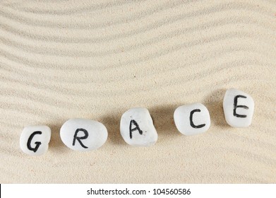 Grace Word On Group Of Stones With Sand Background