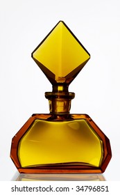 Graceful antique perfume bottle made of amber glass