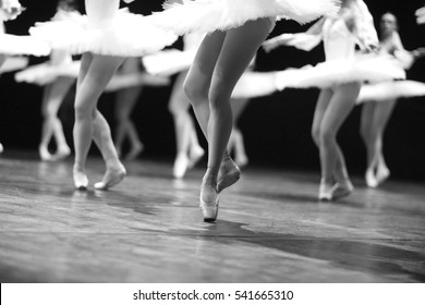 Graceful Ballerinas Feet Dancing On Ballet Shoes On Stage During A Performance