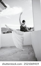 A Graceful Ballet Dancer is Posing Elegantly on a Beautiful Balcony with Scenic Views