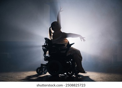 Graceful and elegant movements of a woman with a disability during a solo dance choreography performance on a wheelchair - Powered by Shutterstock