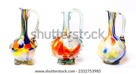 Graceful embellished murano glass vase and jug with multi colored swirls pattern.