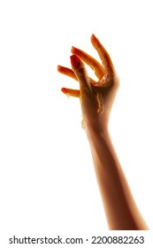 Graceful Female Hand Reaching Up Isolated On White Studio Background. Concept Of Relationship, Feelings, Community, Care, Support, Symbolism, Art. Honey Running Down The Hand. Copy Space For Ad