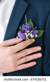 Graceful Stylish Buttonhole Of The Groom From A Iris Closeup.