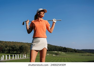 Graceful Swing: Woman Enjoying Golf - Powered by Shutterstock