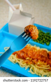 Grade School Lunch Tray Of Italian Spaghetti And Meatballs With Green Peas Milk Carton And Gelatin