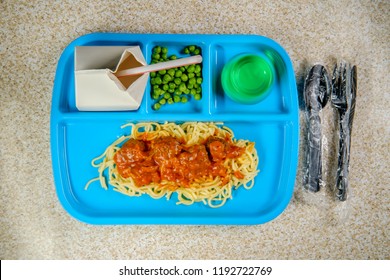 Grade School Lunch Tray Of Italian Spaghetti And Meatballs With Green Peas Milk Carton And Gelatin