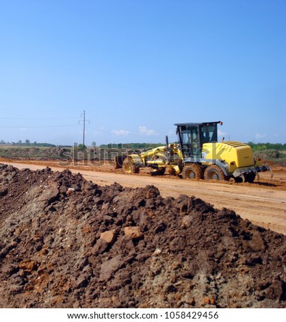 Grader adjust elevation level soil for construction site