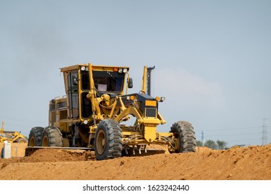 A Grader At Road Constuction Site