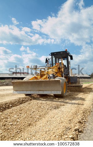 Grader working at road construction site