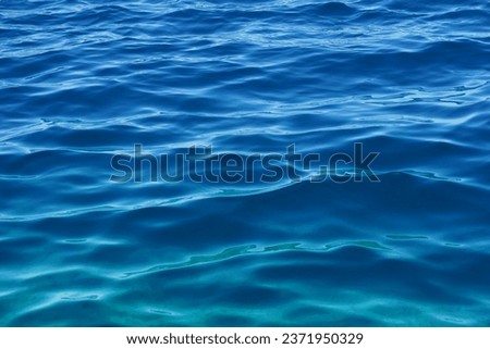 Gradient blue and turquoise colors of wavy abstract deep sea water