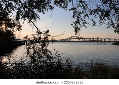 Gradient and silhouette scenes of along the Hackensack Riverwalk in Stephen R. Gregg Park Richard A. Rutkowski Park -- Bayonne, NJ.