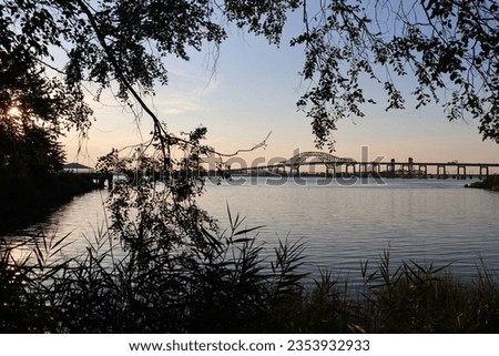Gradient and silhouette scenes of along the Hackensack Riverwalk in Stephen R. Gregg Park Richard A. Rutkowski Park -- Bayonne, NJ.