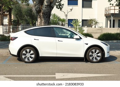 Grado, Italy. July 22, 2022. Tesla Dual Motor, New Version Of Model 3 , Parked In A City Street . It Is The Best Selling Electric Car In History.