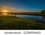 Gradual sunrise over the lake