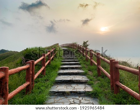 Gradually blurred hillside staircase along with warm sunset in August at Tai O, Hong Kong