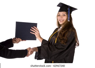 A Graduate Receiving Her Diploma With A Hand Shake.