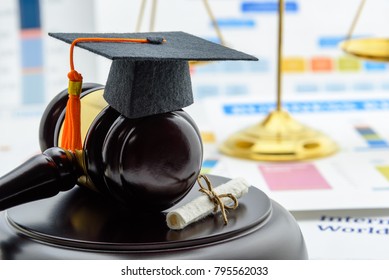Graduate study abroad program concept : Graduation cap on a gavel, balance scale of justice behind, a certificate. Graduate study abroad program is a program that accept students from foreign country