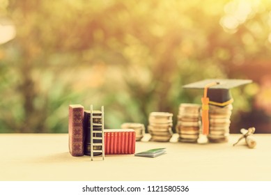 Graduate Study Abroad Program For Higher Degree Education Concept : White Ladder Leans Against Books, Black Graduation Cap On Money, Depicts Attemp Or Endeavor For Student Who Study Hard For Future.