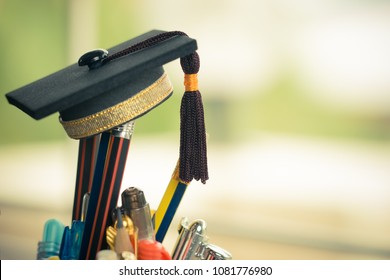Graduate study or Education knowledge is power concept: Graduated cap Put on color pencil in basket. Conceptual for Educational is successs study or business world. Back to School ideas.