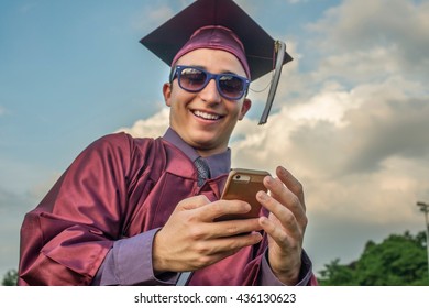 Graduate taking selfie with smartphone - Powered by Shutterstock