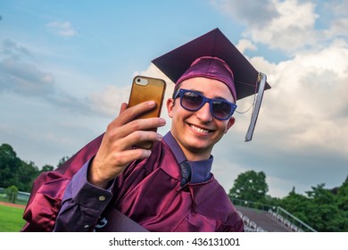 Graduate taking selfie with smartphone - Powered by Shutterstock